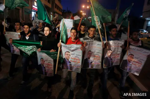 Palestinians take part in a demonstration calling for the release of Mohammed al-Qiq, a Palestinian prisoner on hunger strike, in the West bank city of Hebron on February 16, 2016. Israel's top court rejected Qiq's reque...