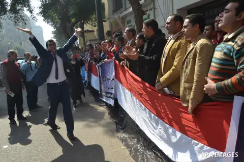 Egyptians take part in a protest to demand jobs in front of the Council of Ministers, in Cairo, Egypt, on February 17, 2016. Photo by Amr Sayed