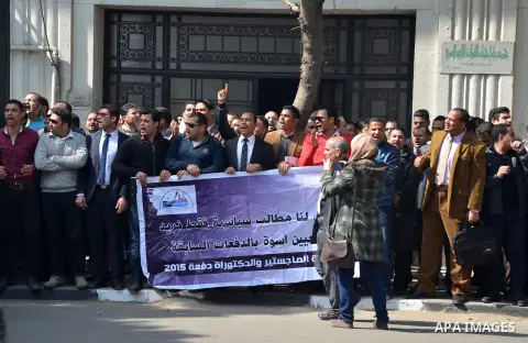Egyptians take part in a protest to demand jobs in front of the Council of Ministers, in Cairo, Egypt, on February 17, 2016. Photo by Amr Sayed