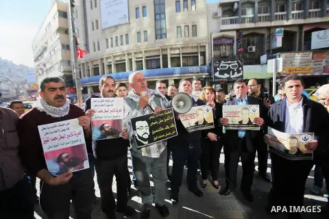 Palestinians take part in a demonstration calling for the release of Mohammed al-Qiq, a Palestinian prisoner on hunger strike, in the West bank city of Nablus on February 17, 2016. Israel's top court rejected Qiq's reque...