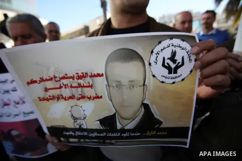 Palestinians take part in a demonstration calling for the release of Mohammed al-Qiq, a Palestinian prisoner on hunger strike, in the West bank city of Nablus on February 17, 2016. Israel's top court rejected Qiq's reque...