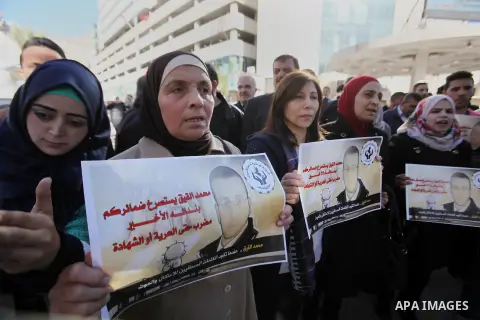 Palestinians take part in a demonstration calling for the release of Mohammed al-Qiq, a Palestinian prisoner on hunger strike, in the West bank city of Nablus on February 17, 2016. Israel's top court rejected Qiq's reque...