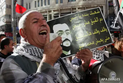 Palestinians take part in a demonstration calling for the release of Mohammed al-Qiq, a Palestinian prisoner on hunger strike, in the West bank city of Nablus on February 17, 2016. Israel's top court rejected Qiq's reque...