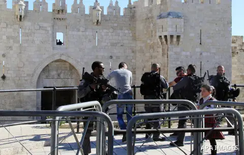 Israeli border policemen perform a body search on a Palestinian youth at Damascus Gate in Jerusalem's Old City February 17, 2016. Photo by Mahfouz Abu Turk