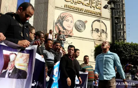 Egyptians take part in a protest to demand jobs in front of the journalists syndicate, in Cairo, Egypt, on February 17, 2016. Photo by Alaa Elkassas