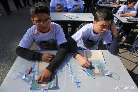 Palestinian students take part in a demonstration calling for the release of Mohammed al-Qiq, a Palestinian prisoner on hunger strike, in front of Red cross office in Gaza city, on February 18, 2016. Israel's top court r...