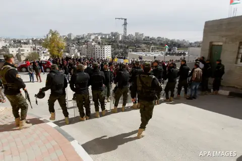 Palestinian teachers take part in a protest to demand their rights, in the West bank city of Hebron, on February 18, 2016. Photo by Wisam Hashlamoun