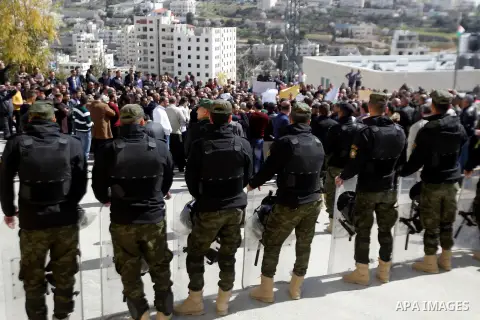 Palestinian teachers take part in a protest to demand their rights, in the West bank city of Hebron, on February 18, 2016. Photo by Wisam Hashlamoun