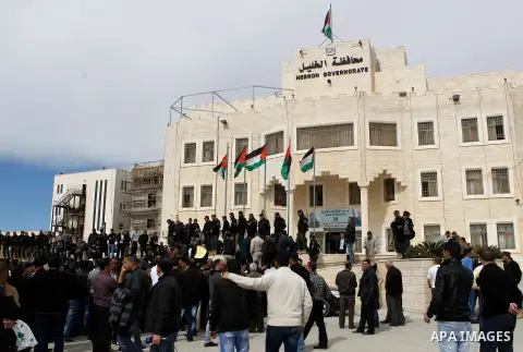 Palestinian teachers take part in a protest to demand their rights, in the West bank city of Hebron, on February 18, 2016. Photo by Wisam Hashlamoun