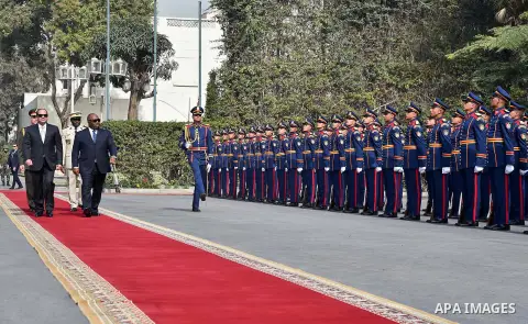 Egyptian President Abdel Fattah al-Sisi and President of Gabon Ali Bongo review the honour guard during a welcome ceremony in the Egyptian capital Cairo on Feb. 18, 2016. Photo by Egyptian President Office