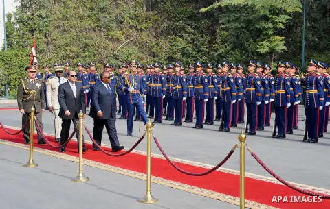 Egyptian President Abdel Fattah al-Sisi and President of Gabon Ali Bongo review the honour guard during a welcome ceremony in the Egyptian capital Cairo on Feb. 18, 2016. Photo by Egyptian President Office
