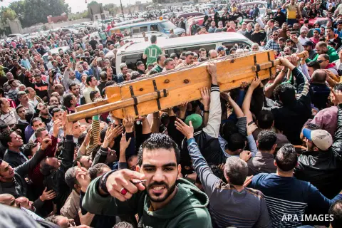 Egyptian mourners carry the coffin of the driver Mohammed Adel who killed by police officer in a dispute in Cairo's el-Darb el-Ahmar district on Feb. 19, 2016. Photo by Amr Sayed