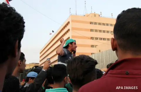 Egyptian Mourners protest the death of Mohamed Ali Sayed Ismail, a 23 year-old driver, who was shot dead overnight during a dispute with a police sergeant, ouside local security headquarters in Cairo, Egypt, Friday, Feb....