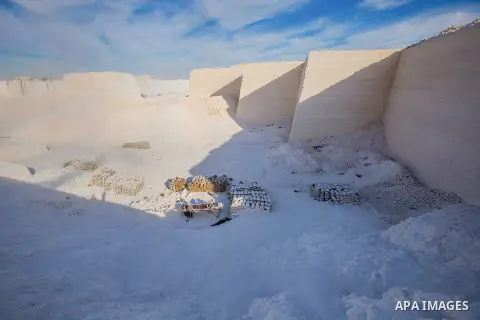 Egyptian Labourers work at a quarry in the desert of Minya governorate, south of Cairo, Egypt, on Feb 20, 2016. In the limestone quarries of Minya province south of Cairo, labourers in sandals and makeshift masks use uns...