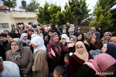 Relatives of Palestinian teenager Qusay Abo Alrob, 16, whom the Israeli military said was shot dead by Israeli troops after he tried to stab a soldier on Sunday mourn during his funeral in the West Bank town of Qabatya n...