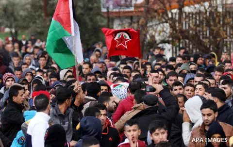Mourners carry the the body of Palestinian teenager Qusay Abo Alrob, 16, whom the Israeli military said was shot dead by Israeli troops after he tried to stab a soldier on Sunday, during his funeral in the West Bank town...