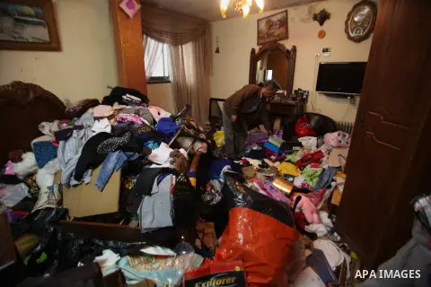 A Palestinian man looks at the bedroom after Israeli troops searched apartments belonging to a same family during an operation to arrest wanted Palestinians in the Askar refugee camp, near Nablus in the Israeli occupied...