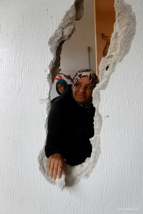 Palestinians check the damage in a house after it was partially demolished by Israeli forces in the West Bank village of Deir Samit, south of Hebron February 23, 2016. Israeli army on Tuesday demolished houses of two Pal...