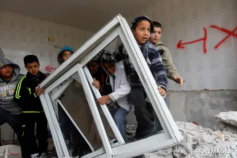 Palestinians check the damage in a house after it was partially demolished by Israeli forces in the West Bank village of Deir Samit, south of Hebron February 23, 2016. Israeli army on Tuesday demolished houses of two Pal...