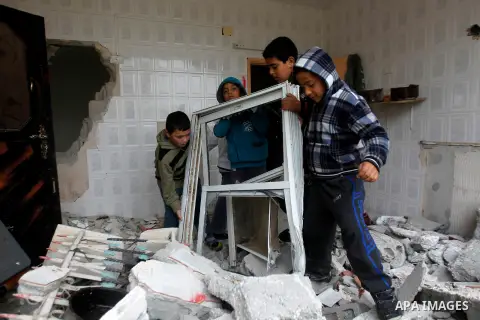 Palestinians check the damage in a house after it was partially demolished by Israeli forces in the West Bank village of Deir Samit, south of Hebron February 23, 2016. Israeli army on Tuesday demolished houses of two Pal...