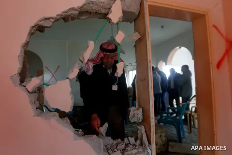 Palestinians check the damage in a house after it was partially demolished by Israeli forces in the West Bank village of Deir Samit, south of Hebron February 23, 2016. Israeli army on Tuesday demolished houses of two Pal...