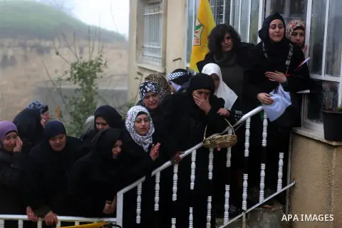Palestinian mourners carry the body of one of two Palestinians, who the Israeli military said were fatally shot by Israeli police officers after they opened fire at them outside Jerusalem's walled Old City on February 14...