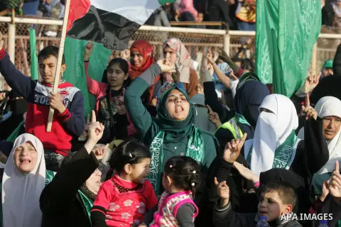 Palestinian supporters of the Hamas islamist movement shout slogans during an anti-Israel rally on February 26, 2016, in the southern Gaza Strip town of Rafah. Photo by Abed Rahim Khatib