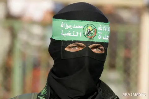 Palestinian militants of the Ezzedine al-Qassam Brigades, the armed wing of the Hamas movement, take part in an anti-Israel rally on February 26, 2016, in the southern Gaza Strip town of Rafah. Photo by Abed Rahim Khatib