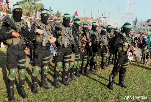 Palestinian militants of the Ezzedine al-Qassam Brigades, the armed wing of the Hamas movement, take part in an anti-Israel rally on February 26, 2016, in the southern Gaza Strip town of Rafah. Photo by Abed Rahim Khatib