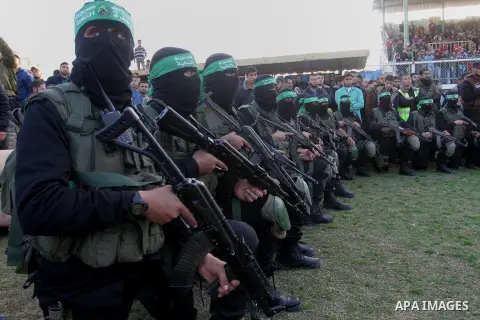 Palestinian militants of the Ezzedine al-Qassam Brigades, the armed wing of the Hamas movement, take part in an anti-Israel rally on February 26, 2016, in the southern Gaza Strip town of Rafah. Photo by Abed Rahim Khatib