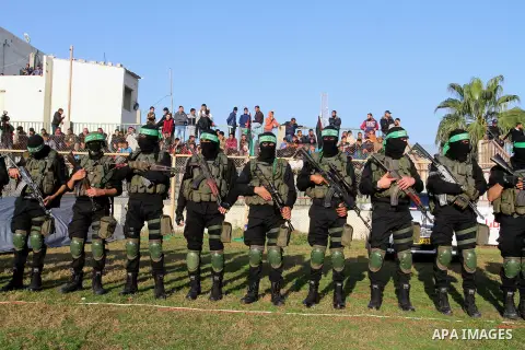 Palestinian militants of the Ezzedine al-Qassam Brigades, the armed wing of the Hamas movement, take part in an anti-Israel rally on February 26, 2016, in the southern Gaza Strip town of Rafah. Photo by Abed Rahim Khatib