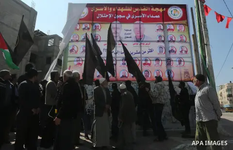 Palestinians take part in a protest demanding release the prisoners in Israeli jails, in Gaza city, on February 28, 2016. Photo by Mohammed Asad