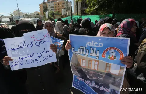 Employees of former Palestinian government take part in a protest to demand for pay their salaries, in Gaza city on March 1, 2016. Photo by Mohammed Asad