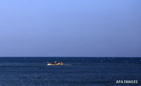 Palestinian fishermen ride their fishing at Gaza's seaport of Gaza City, on March 5, 2016. Photo by Yasser Qudih