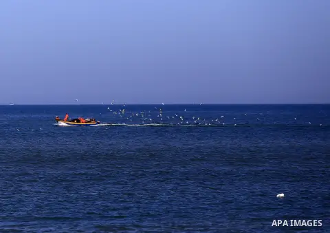 Palestinian fishermen ride their fishing at Gaza's seaport of Gaza City, on March 5, 2016. Photo by Yasser Qudih