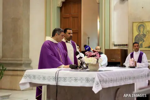 Clergymen pray before the altar in memory of Italian PhD student Guilio Regeni, who was tortured and killed in the capital in January, at Saint Joseph's Roman Catholic Church in Cairo, Egypt March 5, 2016. Photo by Amr S...