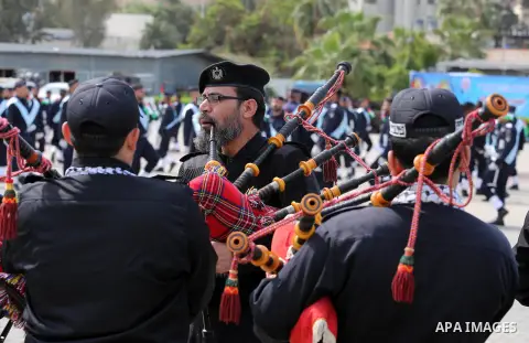 Palestinian members of officers display their skills during a graduation ceremony, in Gaza city, on March 6, 2016. Photo by Mohammed Asad