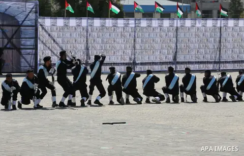 Palestinian members of officers display their skills during a graduation ceremony, in Gaza city, on March 6, 2016. Photo by Mohammed Asad