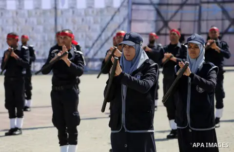 Palestinian members of officers display their skills during a graduation ceremony, in Gaza city, on March 6, 2016. Photo by Mohammed Asad