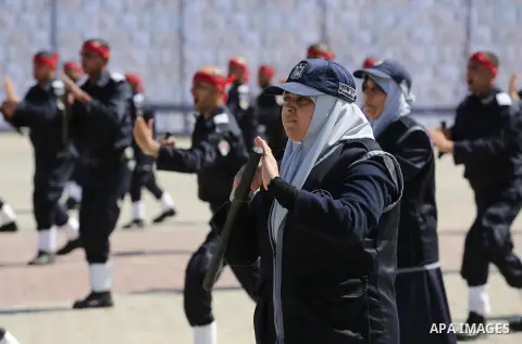 Palestinian members of officers display their skills during a graduation ceremony, in Gaza city, on March 6, 2016. Photo by Mohammed Asad