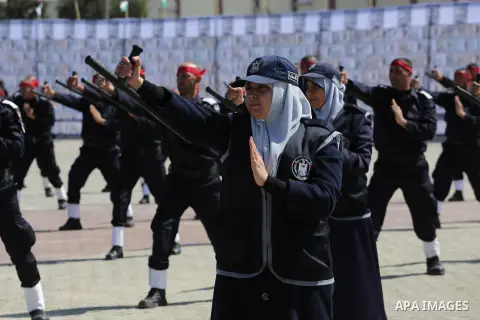 Palestinian members of officers display their skills during a graduation ceremony, in Gaza city, on March 6, 2016. Photo by Mohammed Asad
