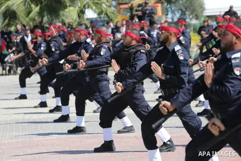 Palestinian members of officers display their skills during a graduation ceremony, in Gaza city, on March 6, 2016. Photo by Mohammed Asad