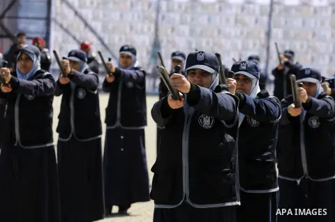 Palestinian members of officers display their skills during a graduation ceremony, in Gaza city, on March 6, 2016. Photo by Mohammed Asad