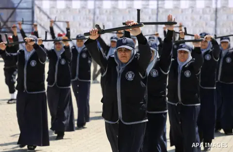 Palestinian members of officers display their skills during a graduation ceremony, in Gaza city, on March 6, 2016. Photo by Mohammed Asad