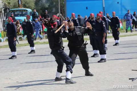 Palestinian members of officers display their skills during a graduation ceremony, in Gaza city, on March 6, 2016. Photo by Mohammed Asad