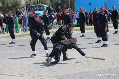Palestinian members of officers display their skills during a graduation ceremony, in Gaza city, on March 6, 2016. Photo by Mohammed Asad