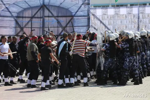 Palestinian members of officers display their skills during a graduation ceremony, in Gaza city, on March 6, 2016. Photo by Mohammed Asad