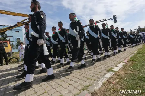 Palestinian members of officers display their skills during a graduation ceremony, in Gaza city, on March 6, 2016. Photo by Mohammed Asad