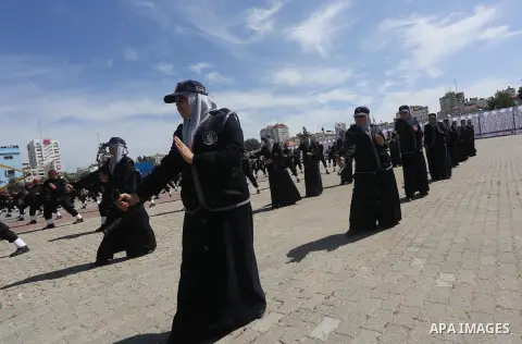 Palestinian members of officers display their skills during a graduation ceremony, in Gaza city, on March 6, 2016. Photo by Mohammed Asad