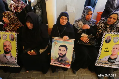 Palestinians take part in a protest demanding release the prisoners in Israeli jails, in front of Red cross office, in Gaza city, on March 7, 2016. Photo by Mohammed Asad